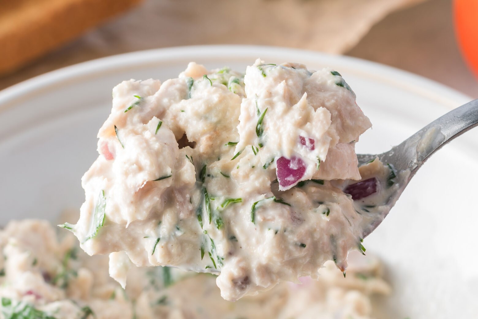 close up of tuna salad on a spoon