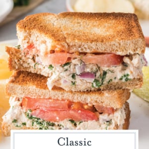 angled shot of stack of tuna salad sandwich halves with text overlay