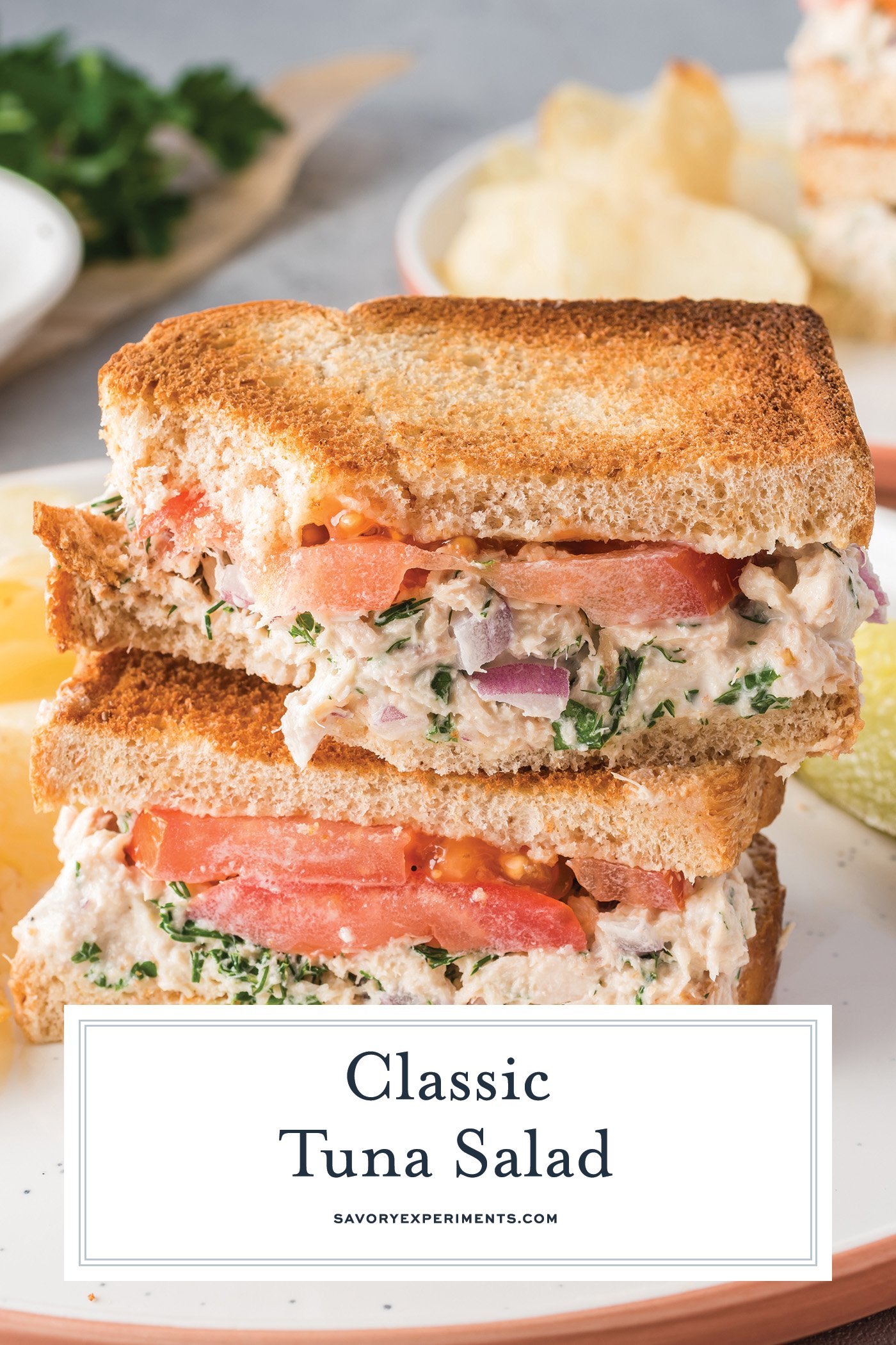 angled shot of stack of tuna salad sandwich halves with text overlay
