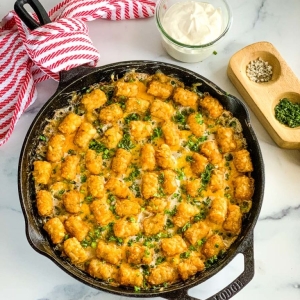 overhead shot of chicken tater tot casserole in skillet