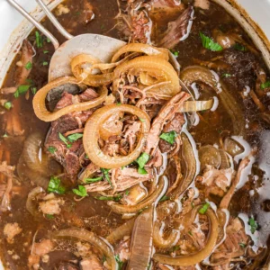 overhead shot of french onion pot roast in slow cooker