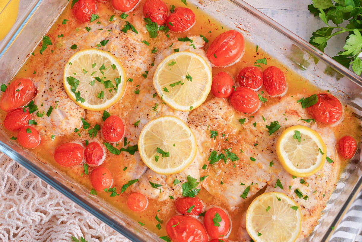 overhead shot of baked tilapia in baking dish