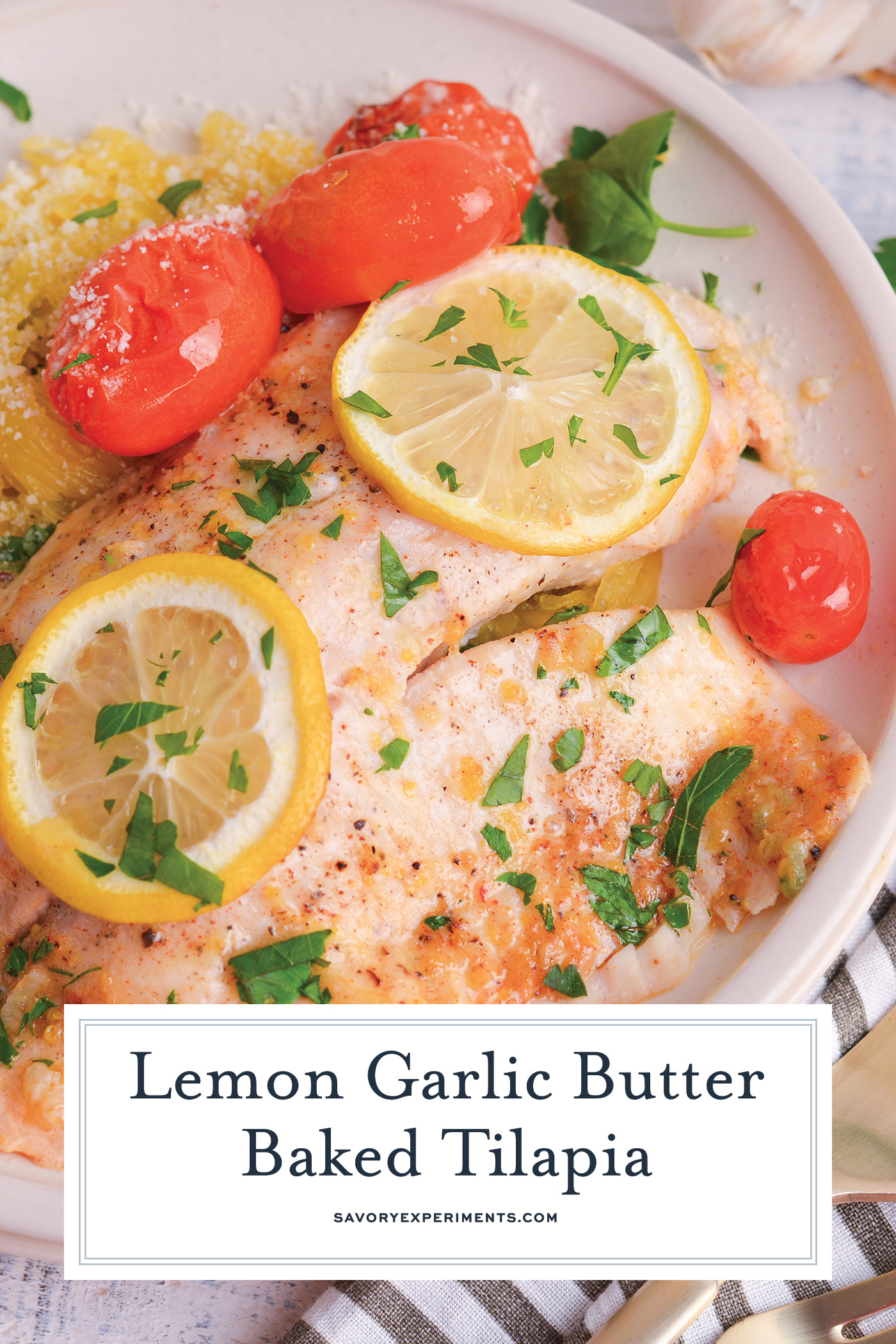 angled shot of lemon garlic butter baked tilapia on plate with text overlay
