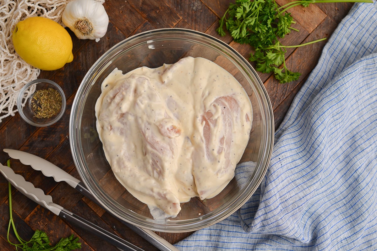 chicken marinating in caesar dressing