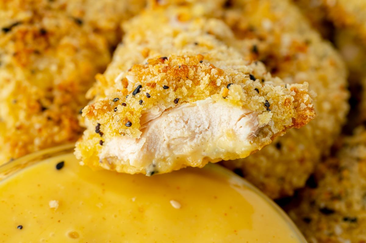 close up of bite taken out of everything seasoning chicken tender