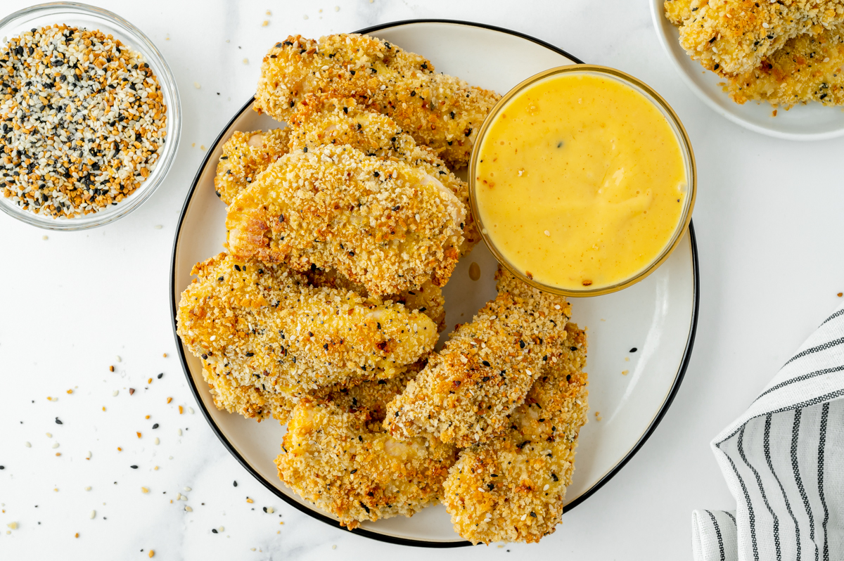 overhead shot of plate of everything seasoning chicen tenders with honey mustard