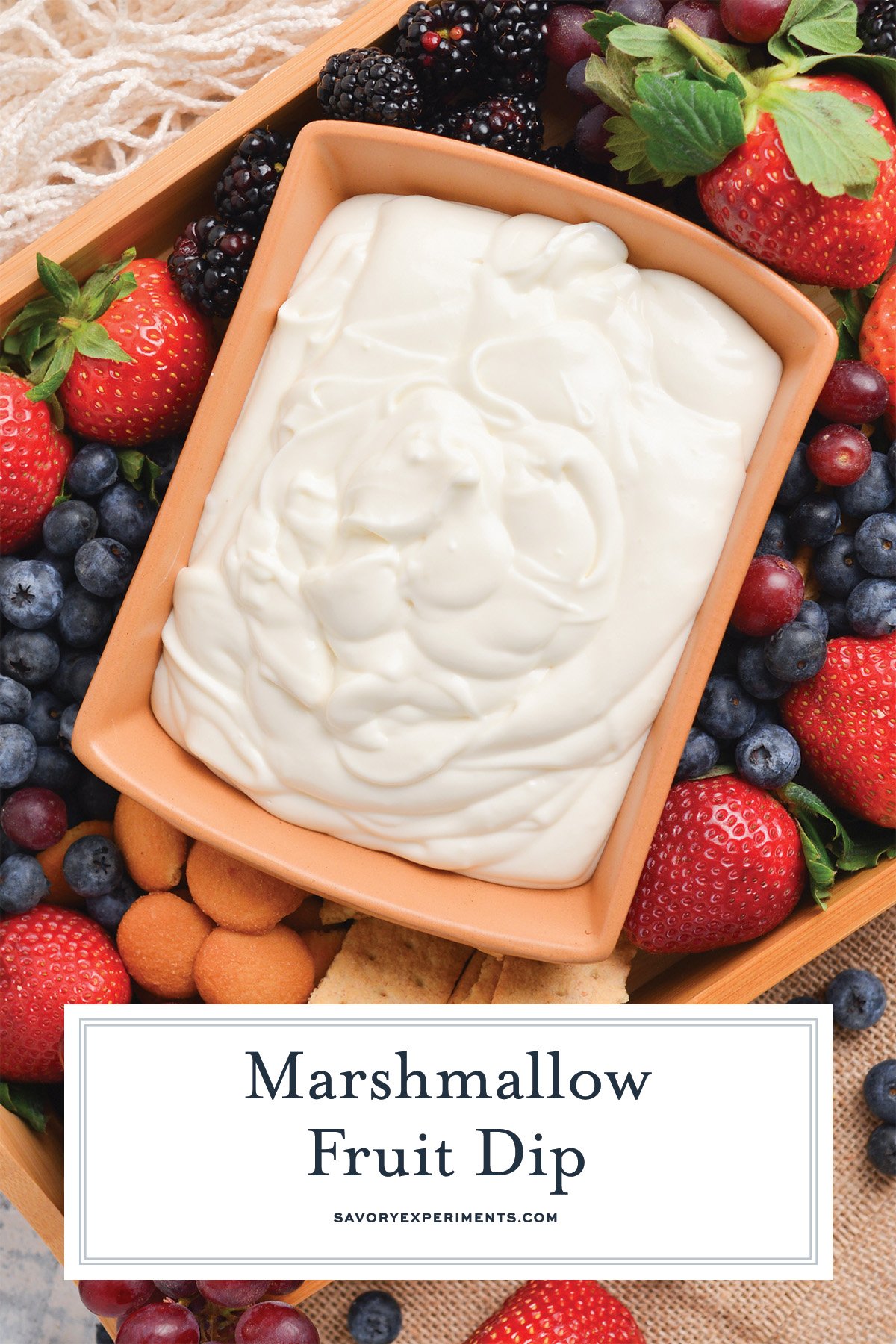 overhead of marshmallow fruit dip with text overlay for pinterest