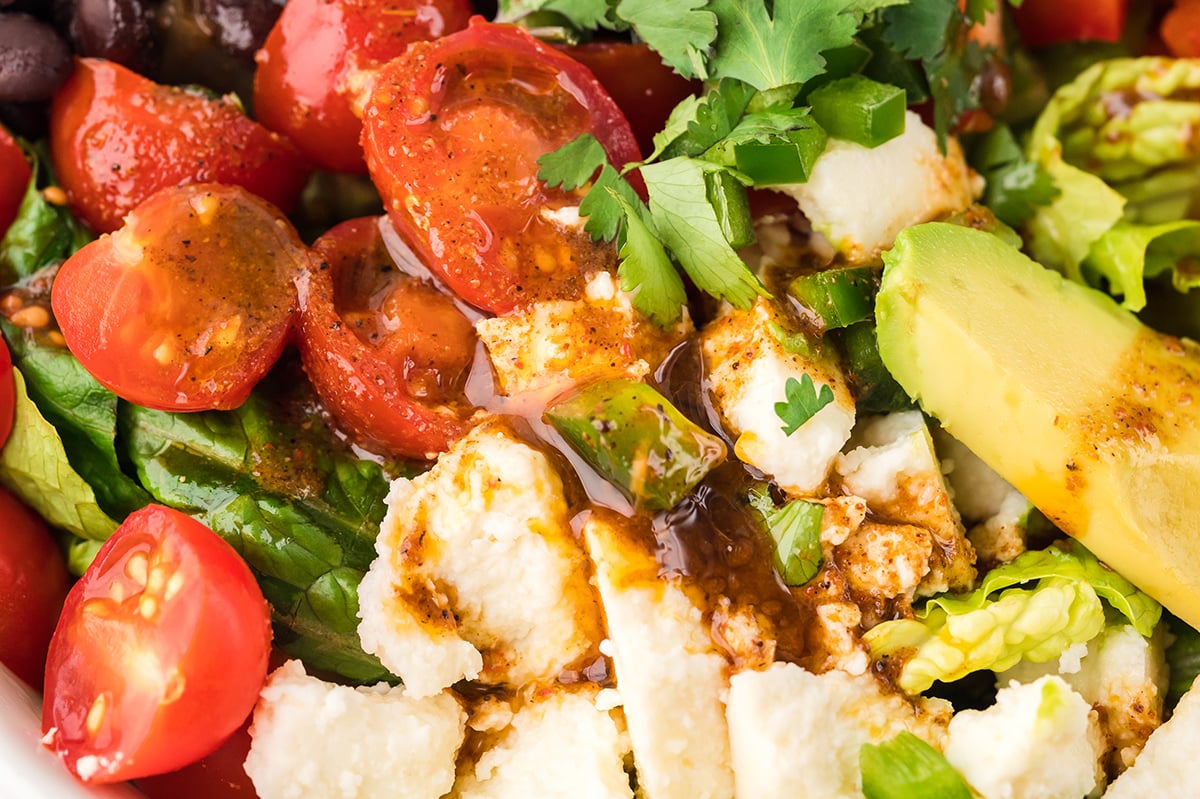 close up of dressing on mexican salad