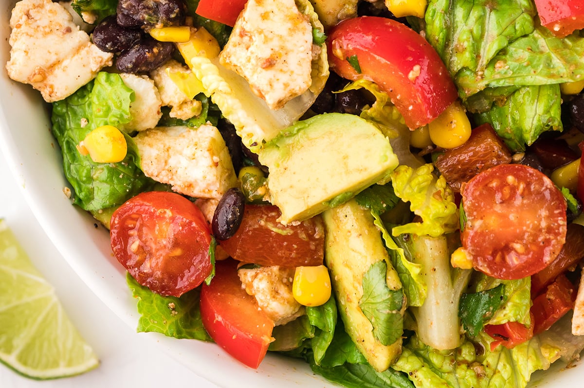 close up half shot of taco salad in bowl