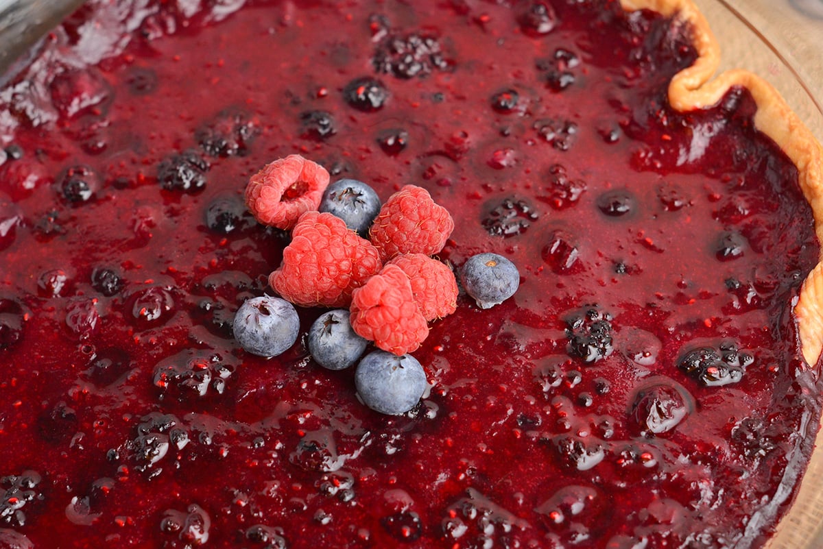 close up angled shot of mixed berry pie