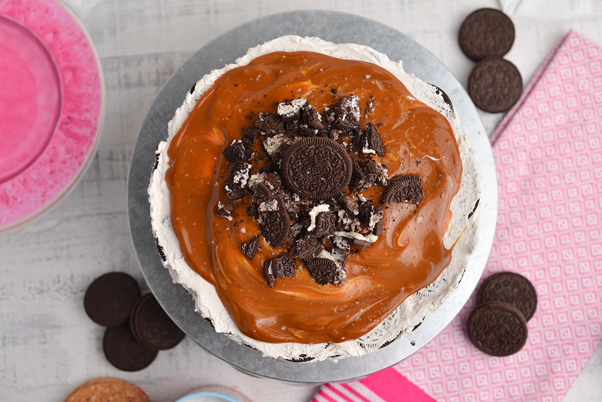 overhead of no-cook oreo icebox cake with caramel topping
