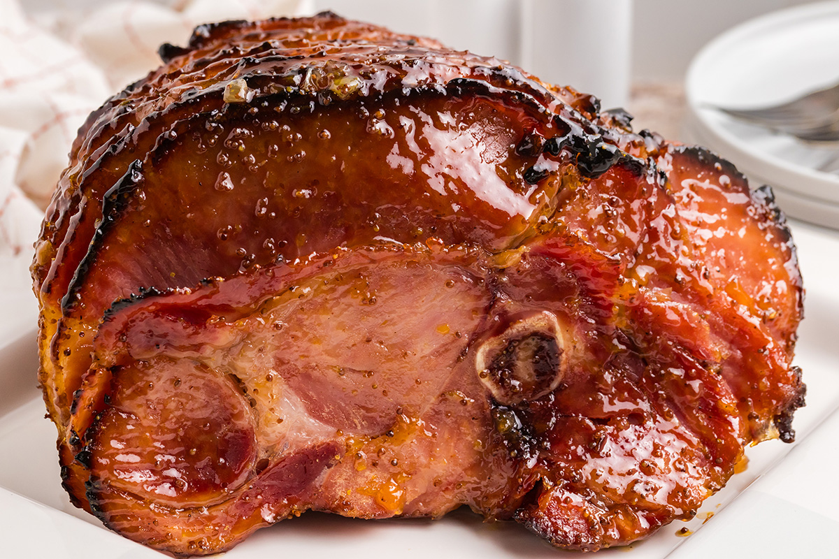 straight on shot of riesling peach glazed ham on platter