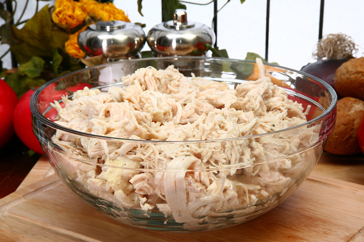 angled shot of bowl of shredded chicken