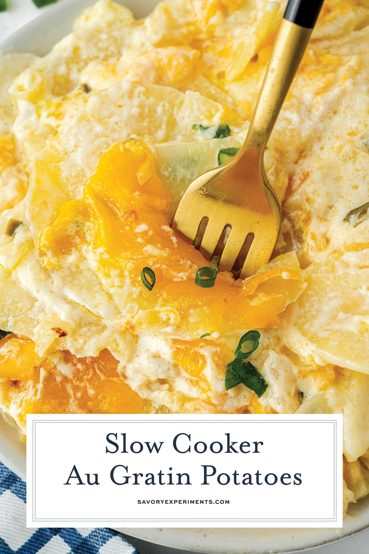 angled shot of fork in slow cooker potatoes au gratin with text overlay