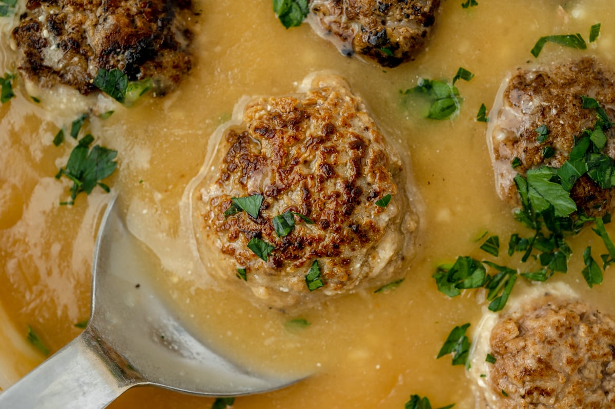 close up overhead shot of swedish meatball on serving spoon
