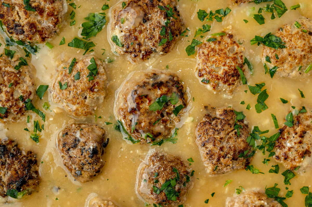 close up overhead shot of swedish meatballs in sauce