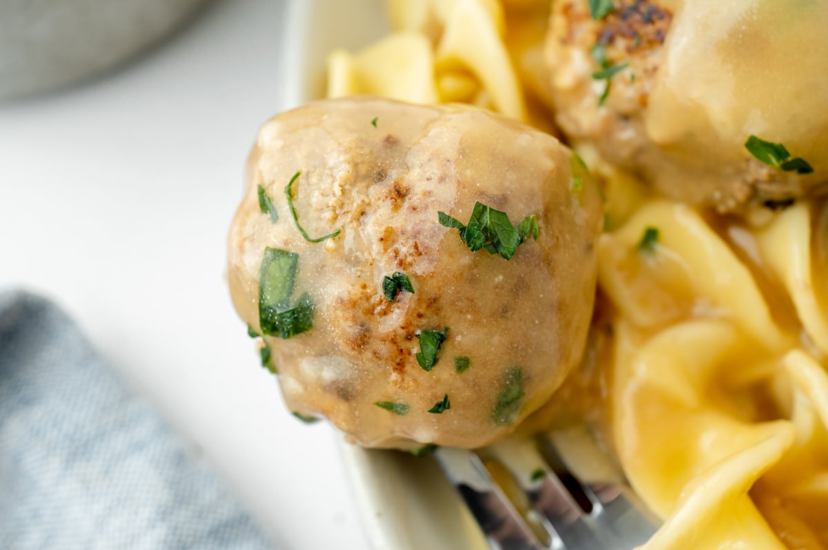 close up of swedish meatball on fork