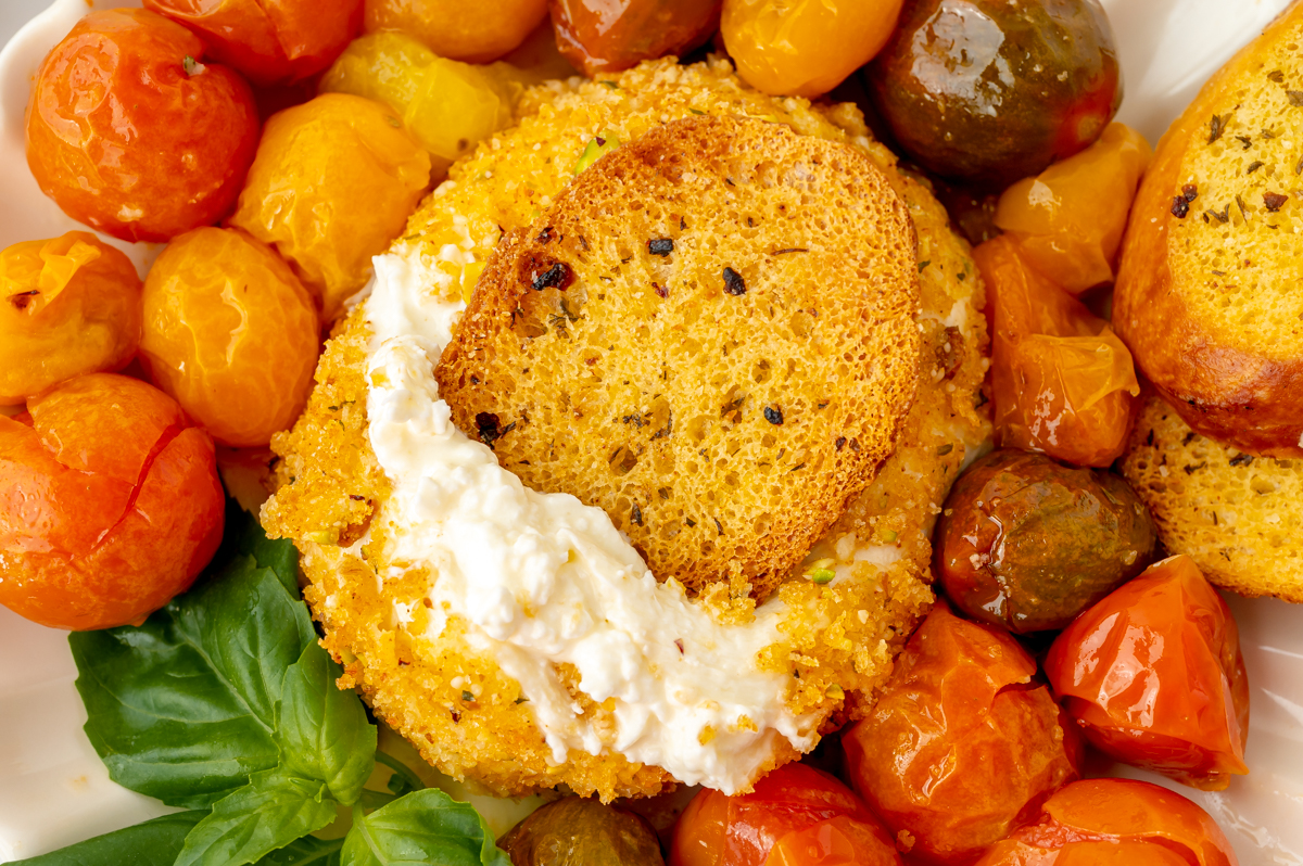 close up shot of toasted bread dipping into air fryer burrata