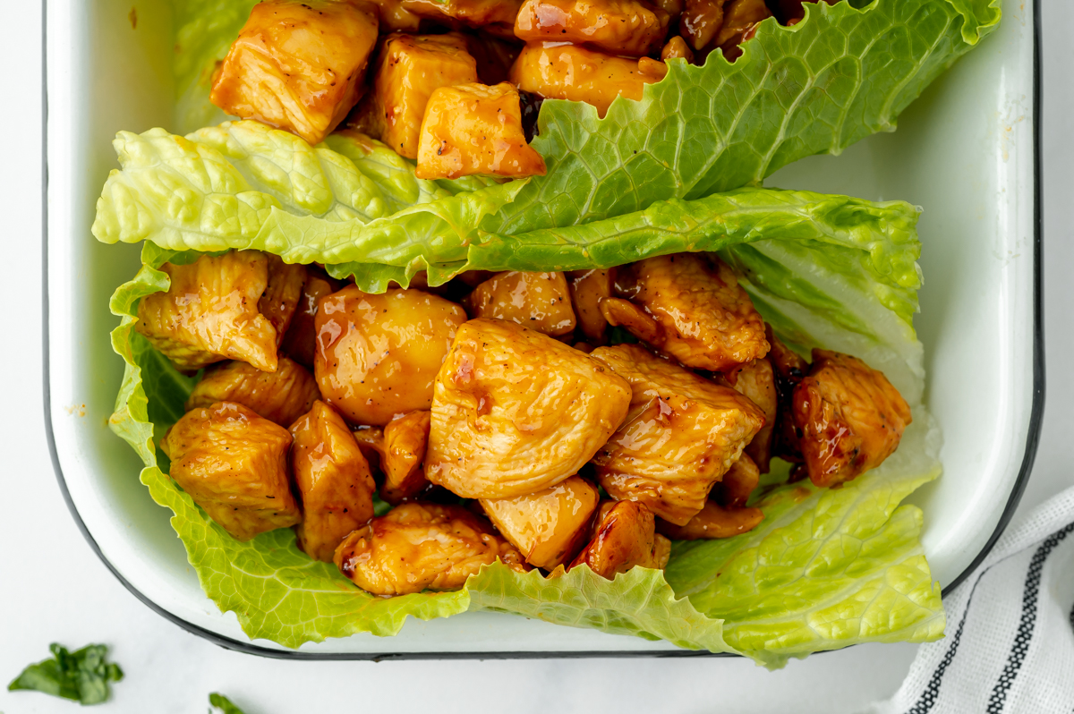 overhead shot of bbq chicken wrapped in lettuce