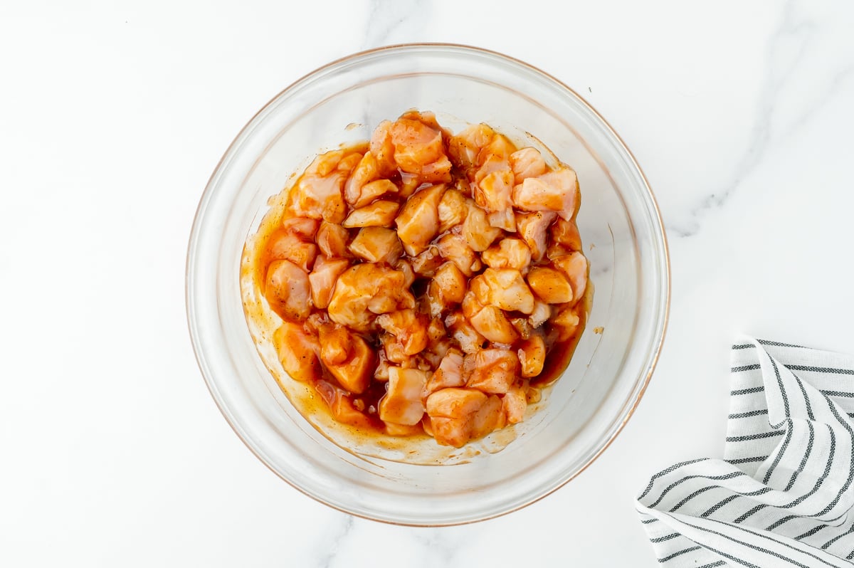 bowl of chicken tossed in bbq sauce