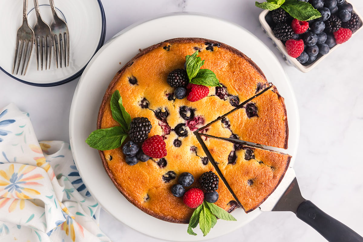 overhead shot of sliced berry ricotta cheesecake