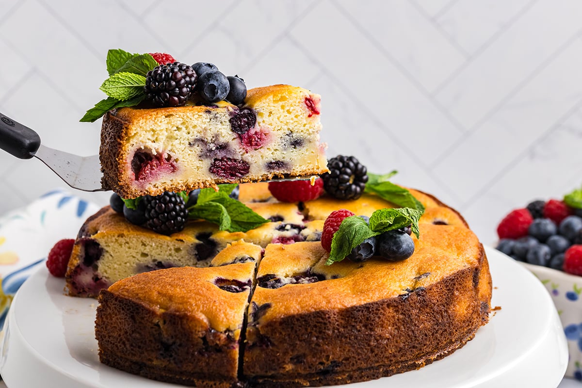 spatula serving slice of berry ricotta cheesecake