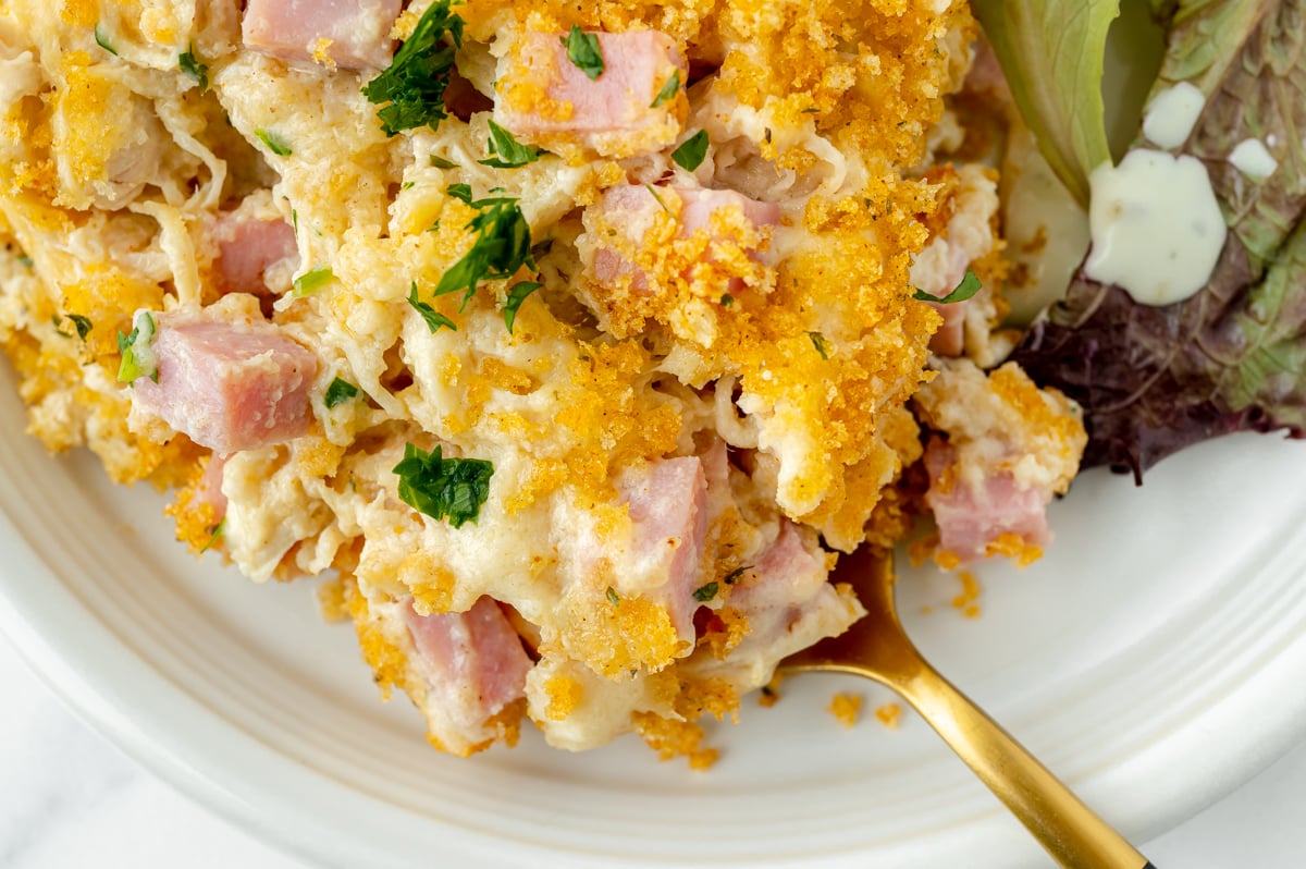 overhead shot of fork in chicken cordon bleu casserole