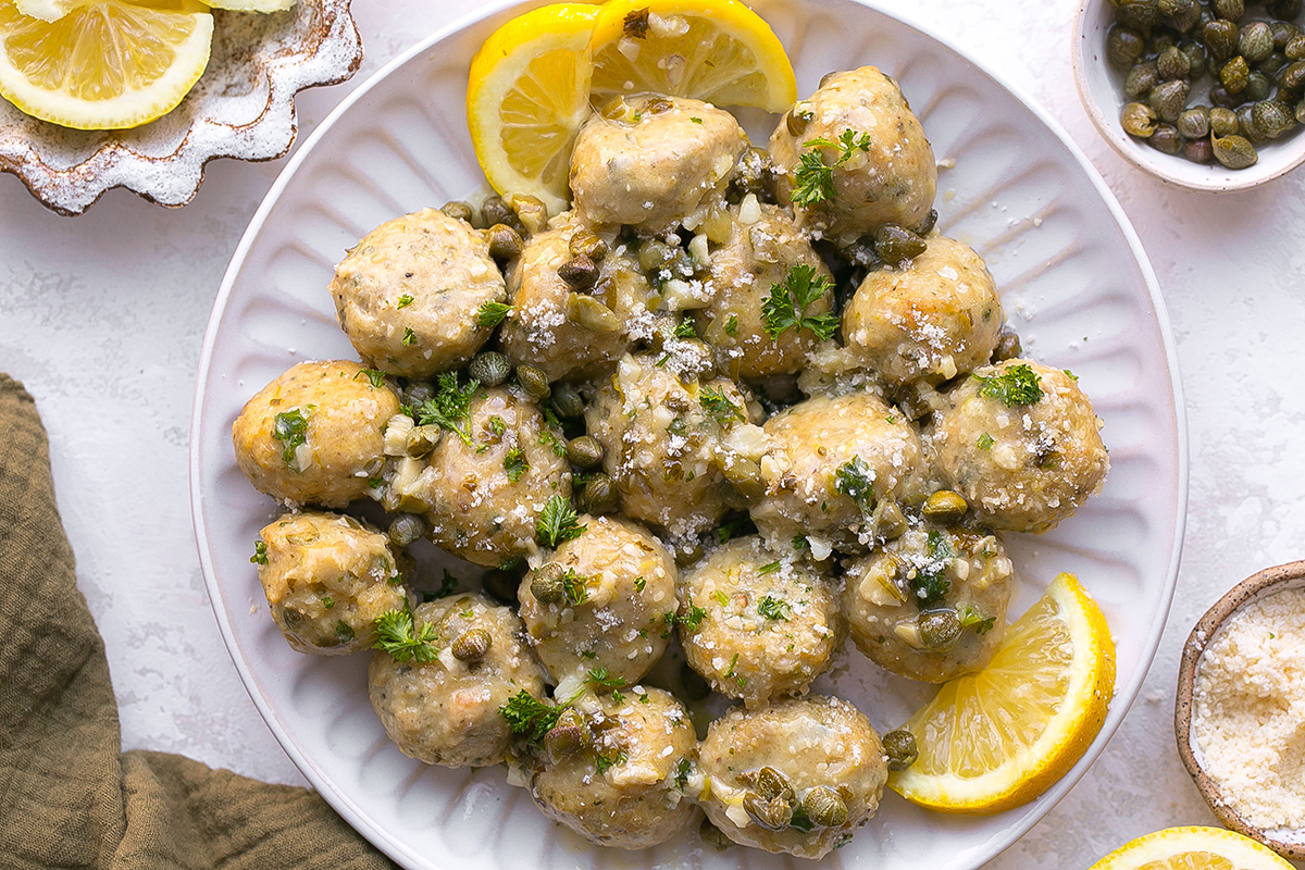 overhead shot of plate of chicken piccata meatballs