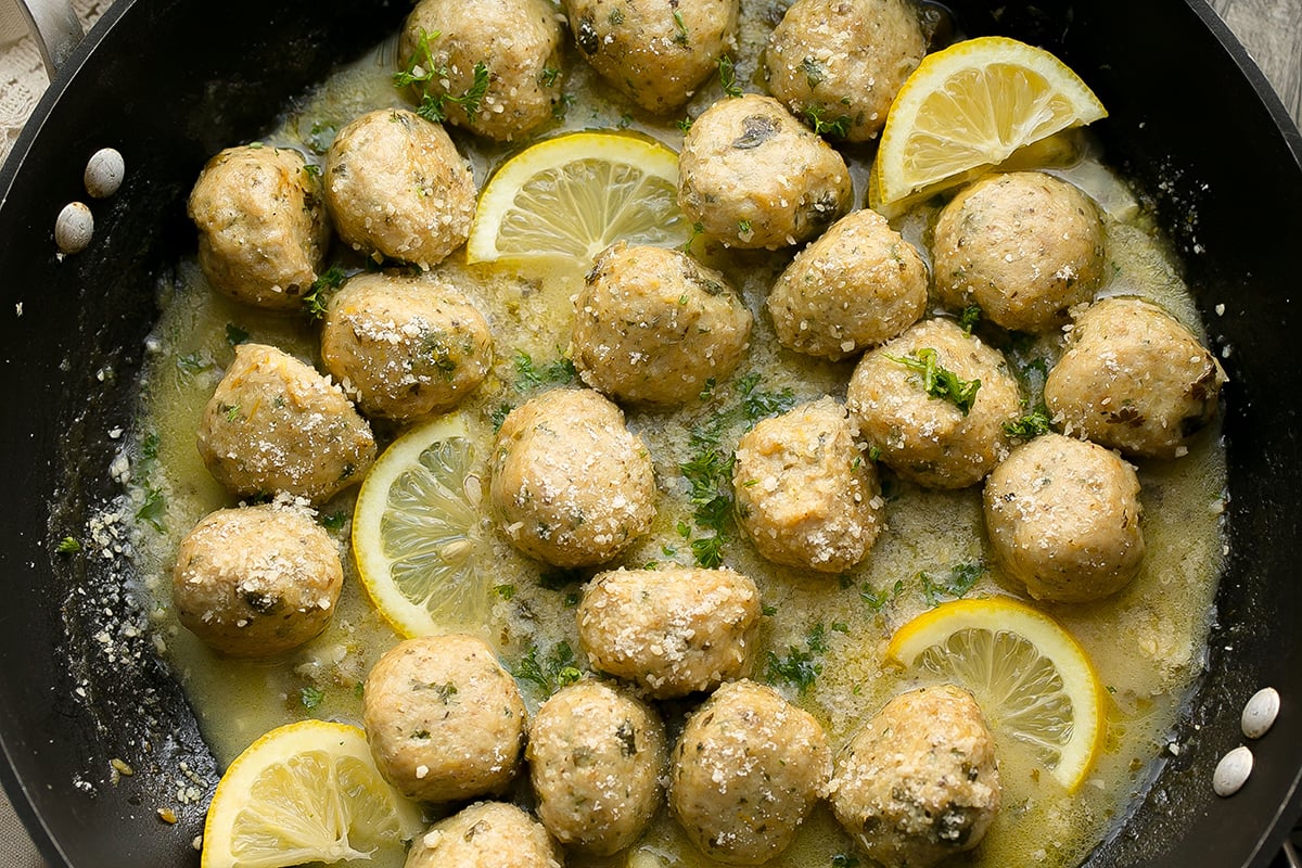 overhead shot of pan of chicken piccata meatballs