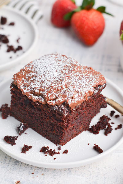 angled shot of slice of beet chocolate cake on plate