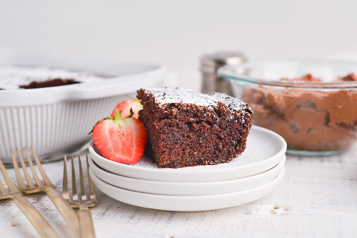 straight on shot of slice of beet chocolate cake on stack of plates