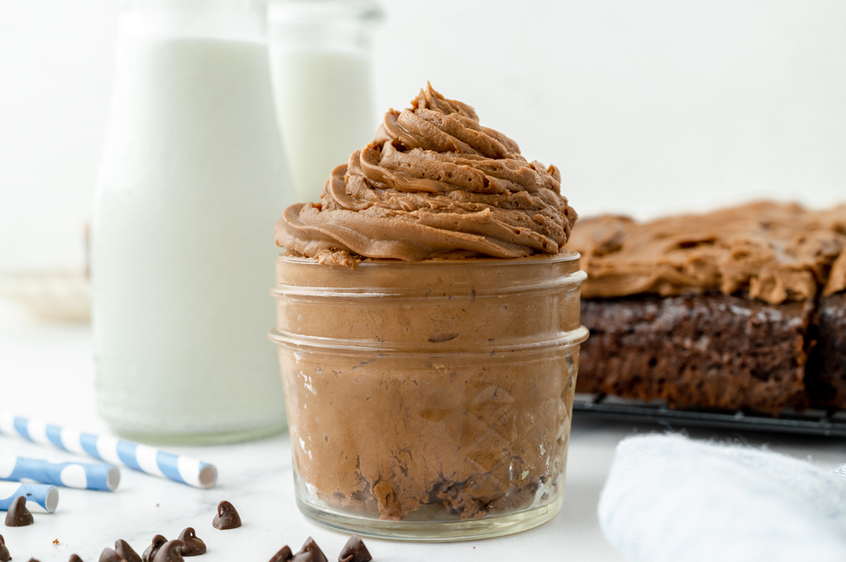 light and fluffy chocolate frosting in a small glass jar 