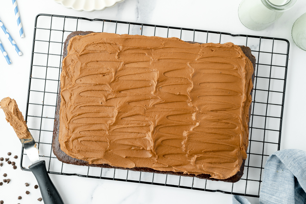 overhead shot of easy chocolate frosting spread onto cake