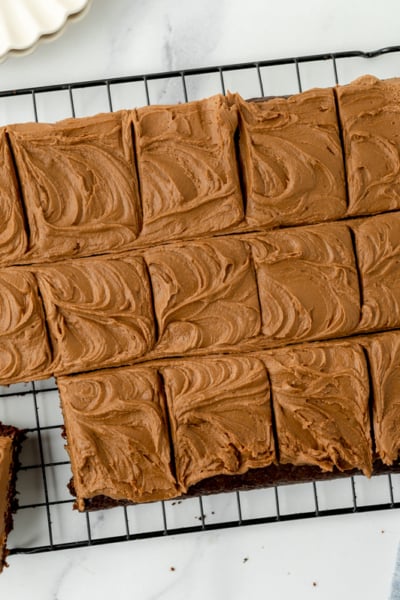 overhead shot of sliced chocolate mayonnaise cake on cooling rack