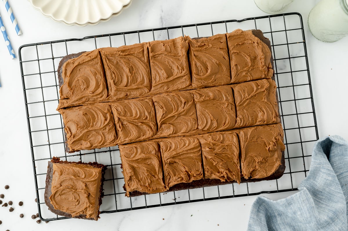 overhead shot of sliced chocolate mayonnaise cake on cooling rack