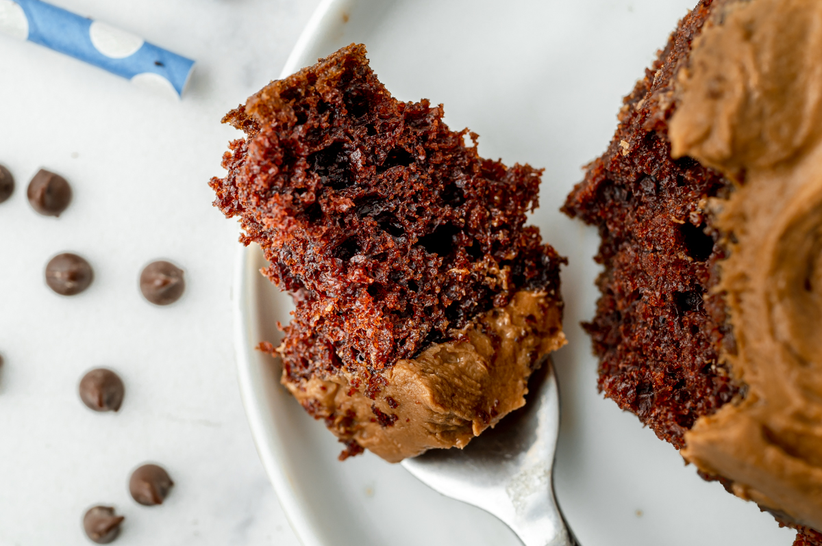 close up of bite of chocolate cake on fork