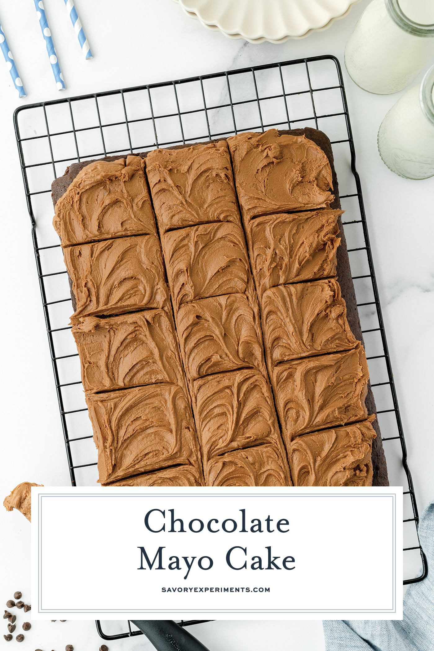 overhead shot of sliced chocolate mayonnaise cake on cooling rack with text overlay