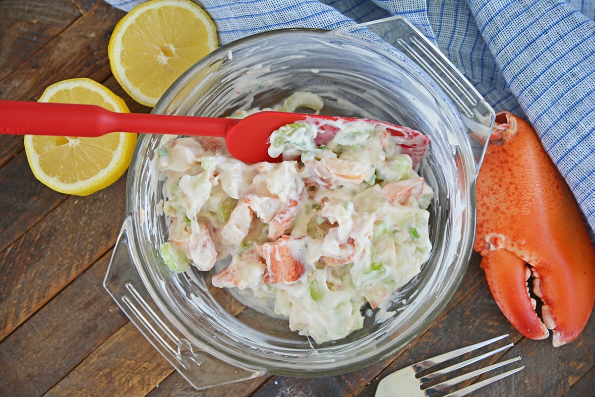 cold lobster salad mixed together in a mixing bowl