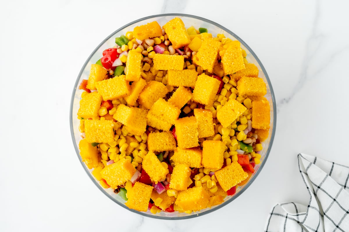 cornbread cubes over veggies on bowl