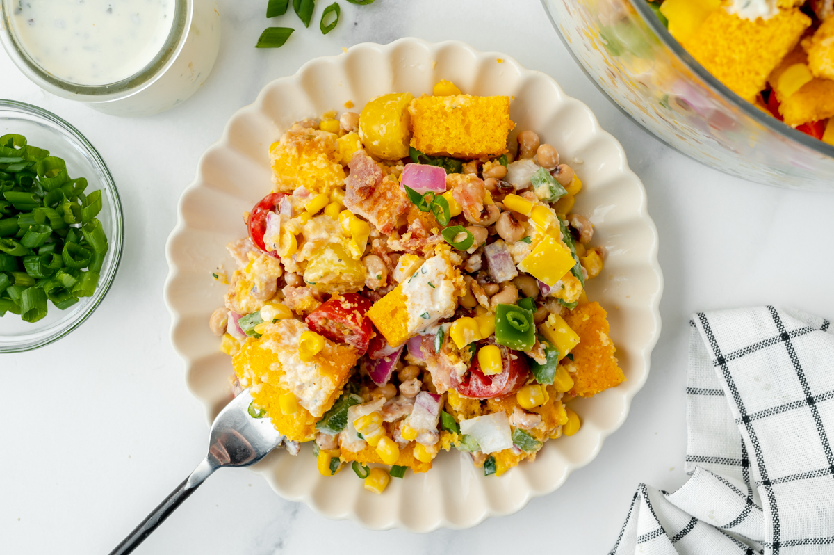overhead shot of cornbread salad on plate with fork