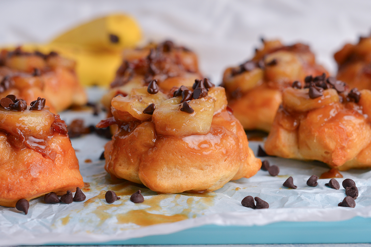 straight on shot of banana monkey bread muffins on parchment paper