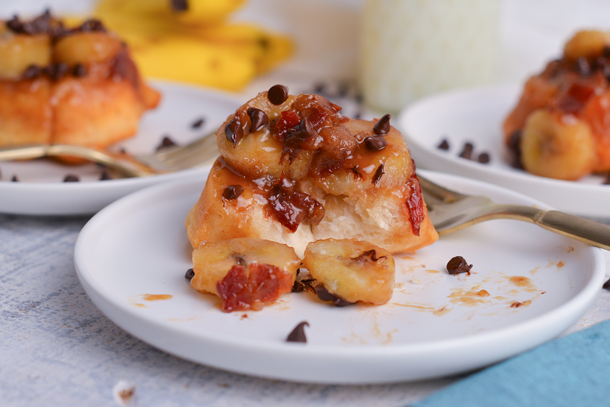 close up of bite taken out of fat elvis monkey bread on plate