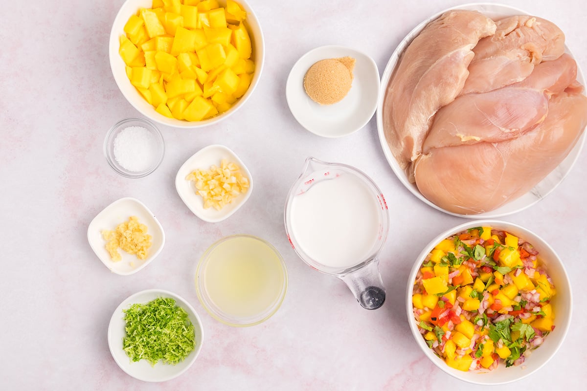 overhead shot of ingredients for mango chicken marinade with fresh mango salsa 