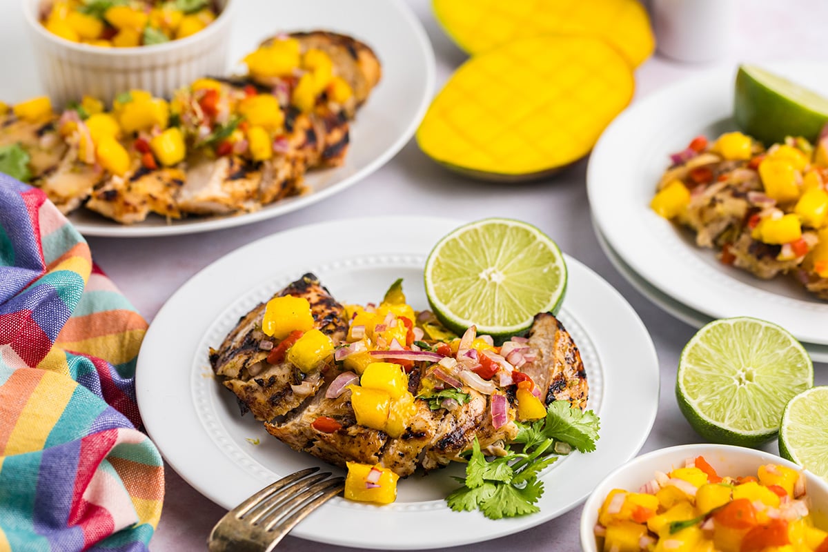 angled shot of plate of grilled mango chicken