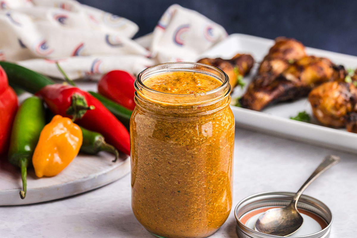 angled shot of peri peri sauce in jar