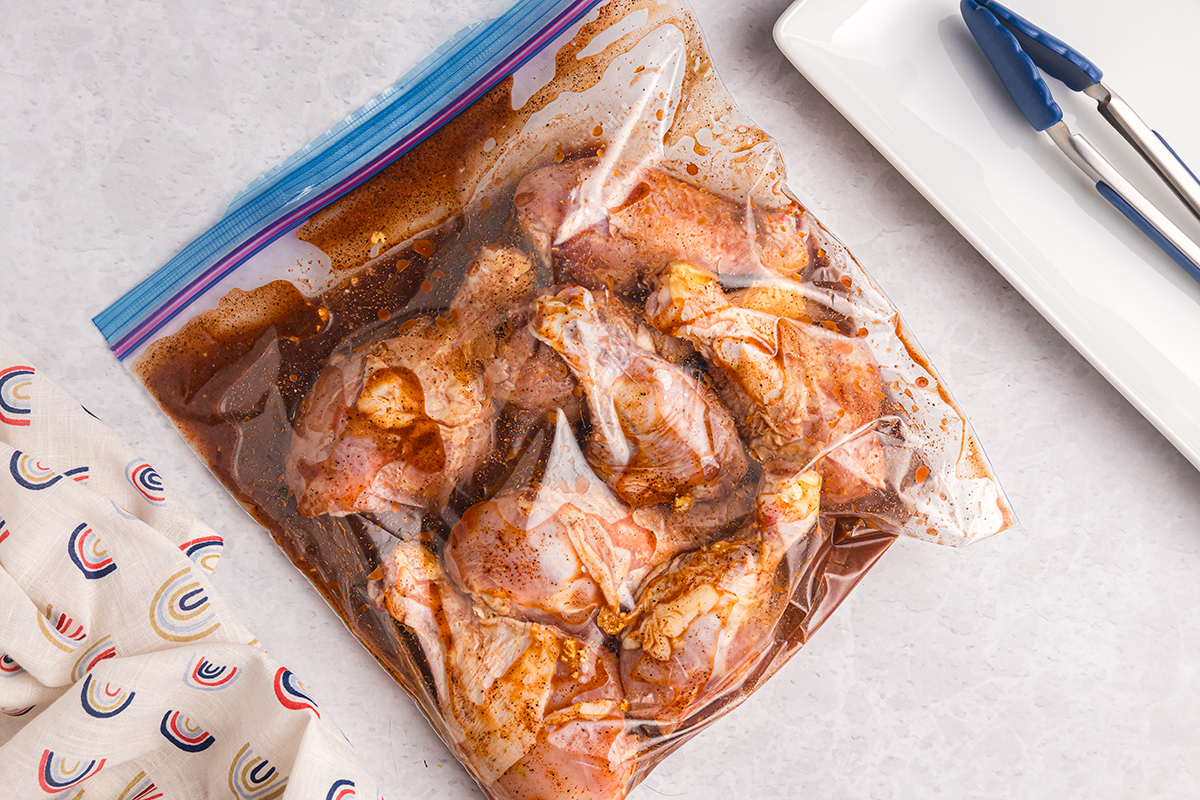 chicken drumsticks marinating in bag