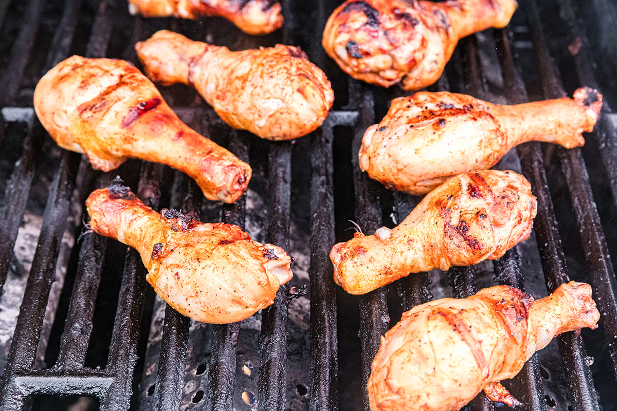 angled shot of chicken on grill