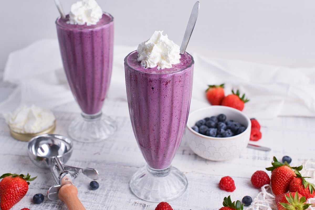 angled shot of two grimace shakes