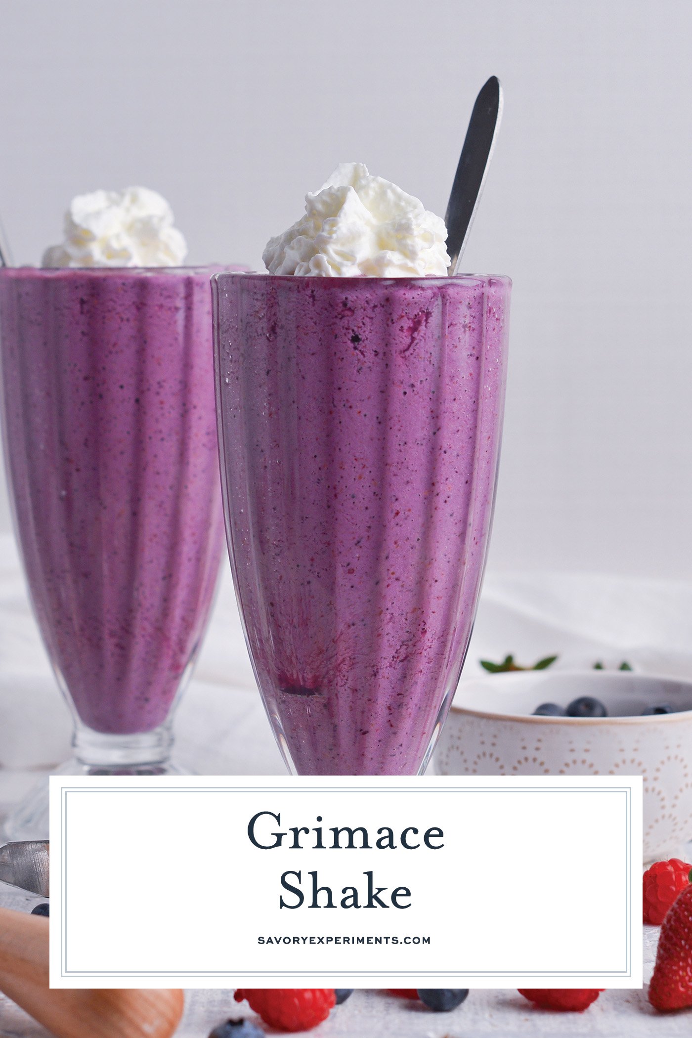 straight on shot of two grimace shakes with text overlay