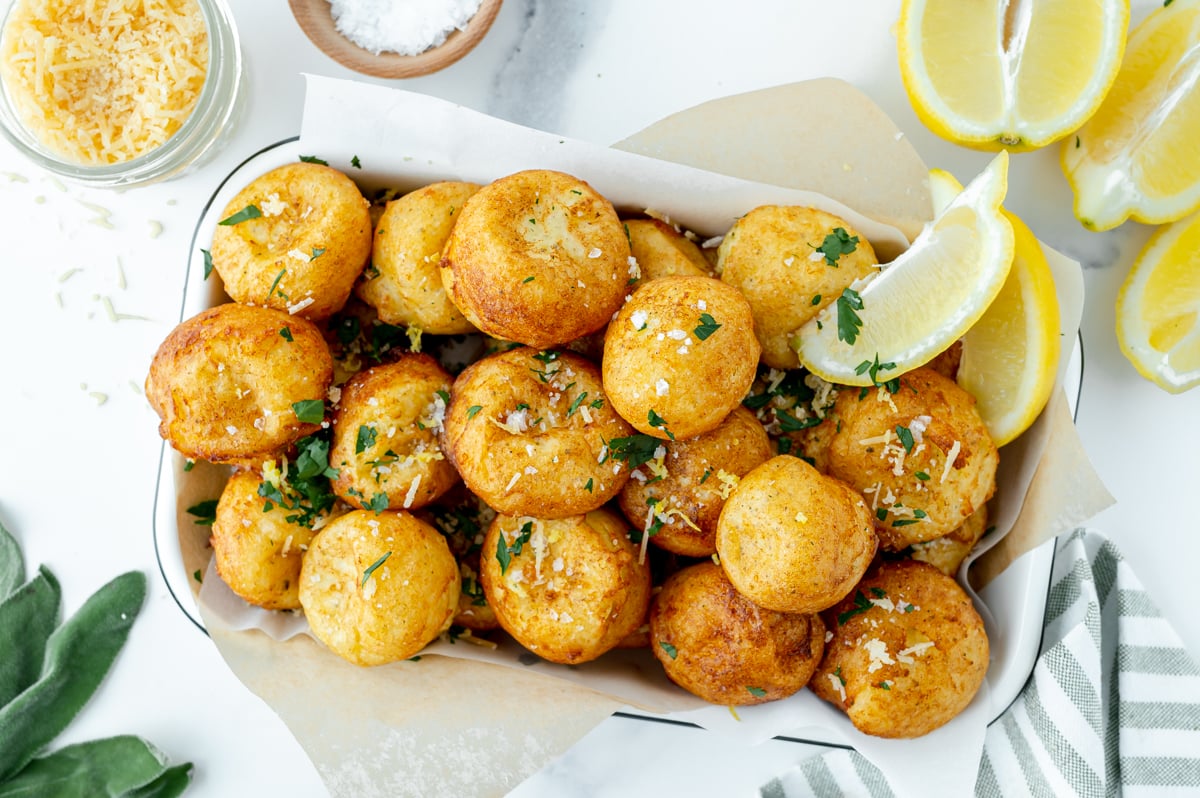 overhead shot of tray full of lemon ricotta fritters